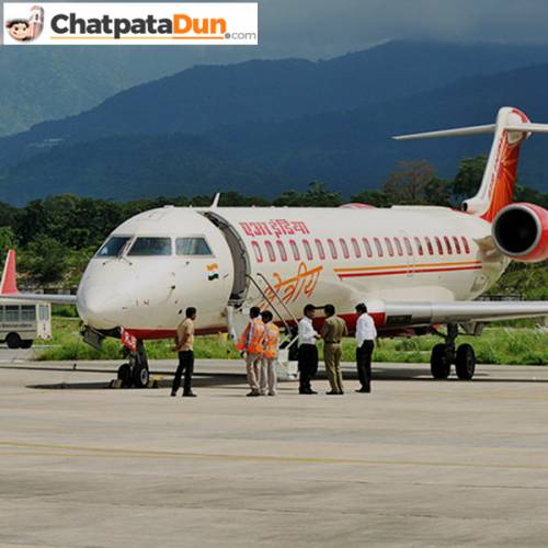 Aeroplane at Jolly Grant Airport with hilly background